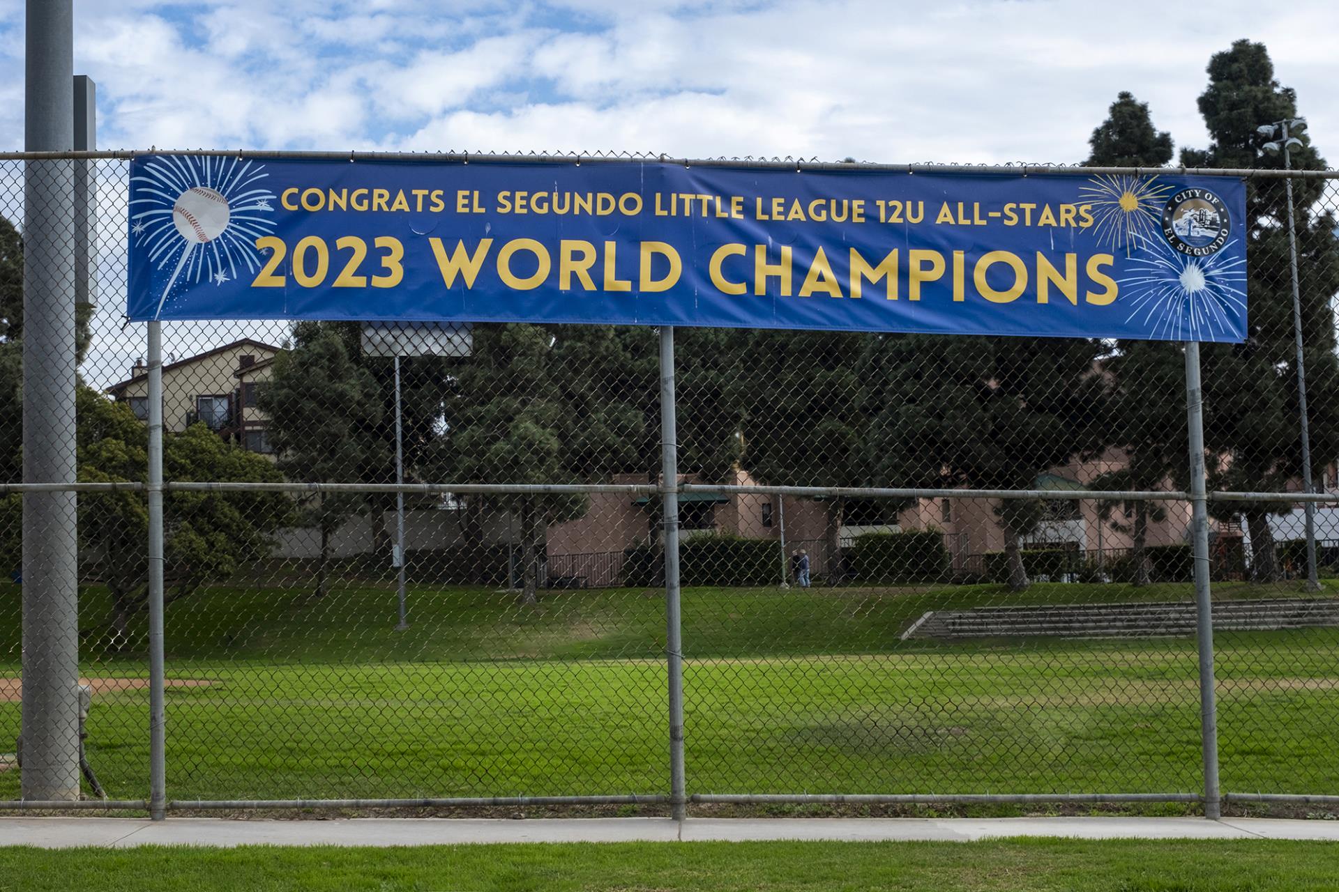 2023 Little League World Champions sign on fence at Brett Field