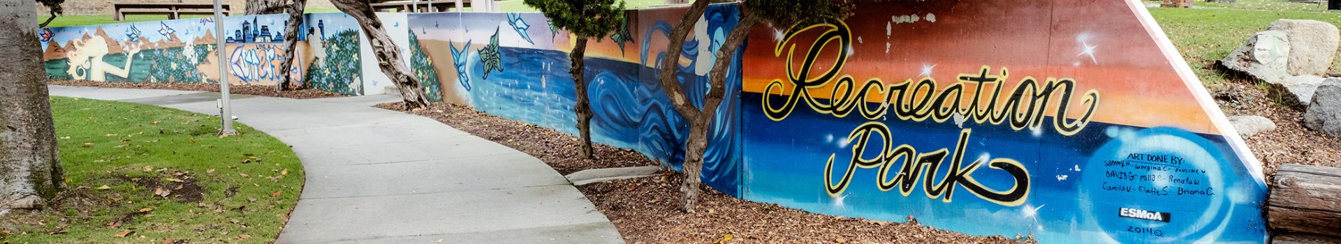 Recreation Park painted on wall with art and sidewalk